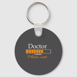 Chaveiro Médico Engraçado Carregando Roupa de Médico Nova