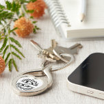 Chaveiro Modern Black Floral Wreath Split Monogram "D"<br><div class="desc">This refined floral split monogram wreath design features a delicate botanical arrangement forming a graceful circular frame around a customizable monogram "D". The balanced composition highlights elegant leaves and floral accents that create a timeless and sophisticated look. This beautiful twisted heart shaped keychain is perfect for personalized gifts, wedding favors,...</div>