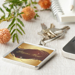 Chaveiro Motivo de Natal ouro com fundo vermelho...