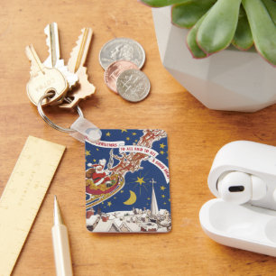 Chaveiro Natais vintages Papai Noel com Rena Voadora