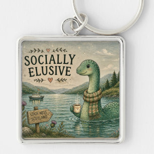 Chaveiro Nessie Esquiva Socialmente Críptico Aconchegante L