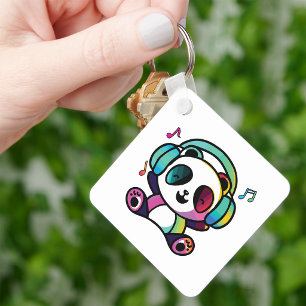 Chaveiro Panda feliz com fones de ouvido ouvindo música.