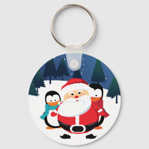 Chaveiro Papai Noel bonito e pinguim na cena do inverno