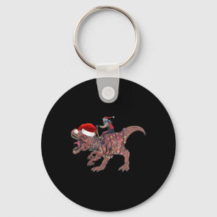 Chaveiro Papai Noel montado em dinossauro T Rex Natal Menin