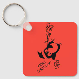 Chaveiro Penguine distributing christmas gifts