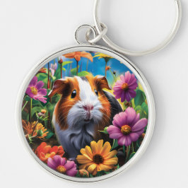 Chaveiro Porco-guineense entre flores vibrantes