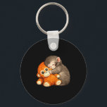 Chaveiro Punch the monkey cuddling stuffed animal meme<br><div class="desc">Punch the monkey cuddling stuffed animal meme internet</div>