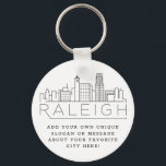 Chaveiro Raleigh, NC Stylizlized Skyline | Slogan Personali<br><div class="desc">Uma cadeia-chave única que representa a bela cidade de Raleigh,  NC. Este chaveiro apresenta uma ilustração estilizada do horizonte único da cidade com seu nome embaixo. Por baixo do nome da cidade está um lugar para o seu slogan ou afirmação exclusivo sobre a sua cidade favorita.</div>