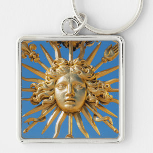 Chaveiro Rei Sol no portão Ouro do castelo de Versalhes