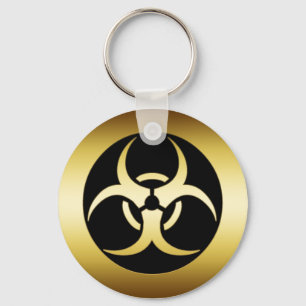 CHAVEIRO SÍMBOLO DOURADO DE BIO-HARZARD