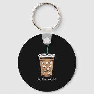 Chaveiro Sobre O Bebendo De Verão De Café Forçado De Rochas