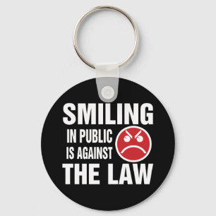 Chaveiro Sorrir em Público é Contra a Lei