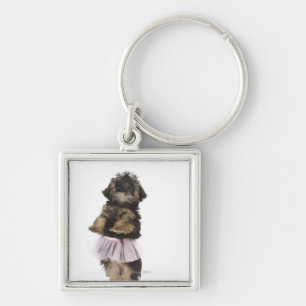 Chaveiro Um filhote de cachorro de Yorkie-poo em um tutu em