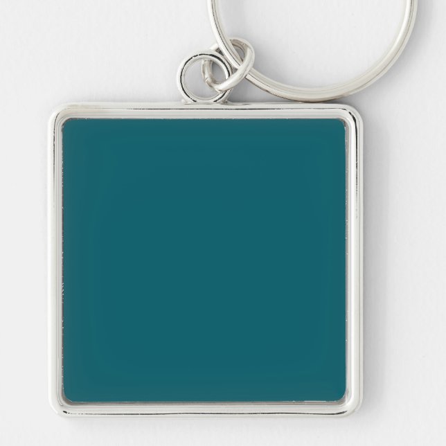 Chaveiro Um fundo azul-teal sólido preenche todo o (Frente)