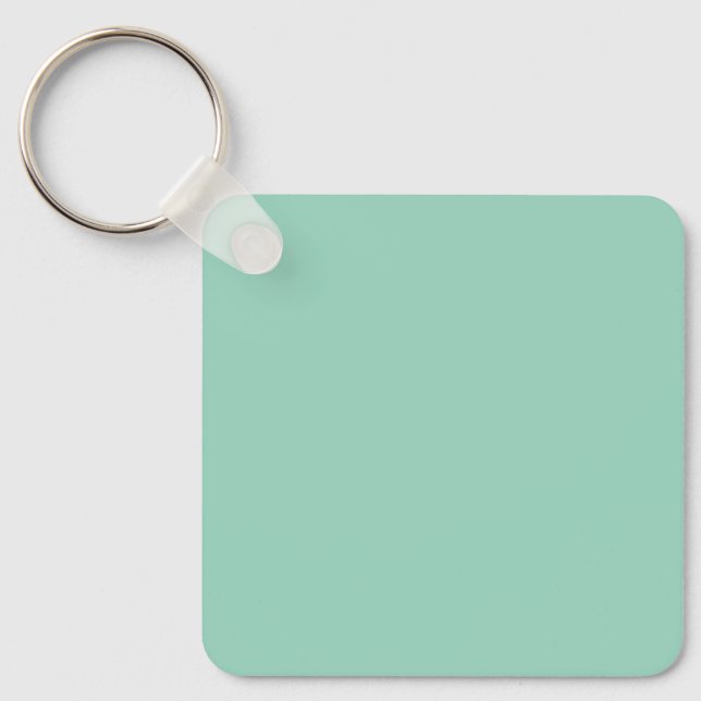 Chaveiro Um fundo verde menta sólido com uma textura suave (Frente)