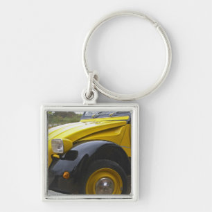 Chaveiro Um velho Citroen 2CV 2 CV preto e amarelo,