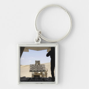 Chaveiro Uma empilhadeira carrega a carga em A.A. - 130