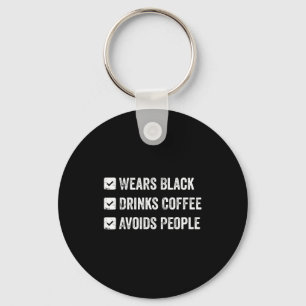Chaveiro Veste preto bebe café evita pessoas