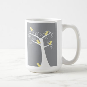 Cinco aves amarelas numa caneca