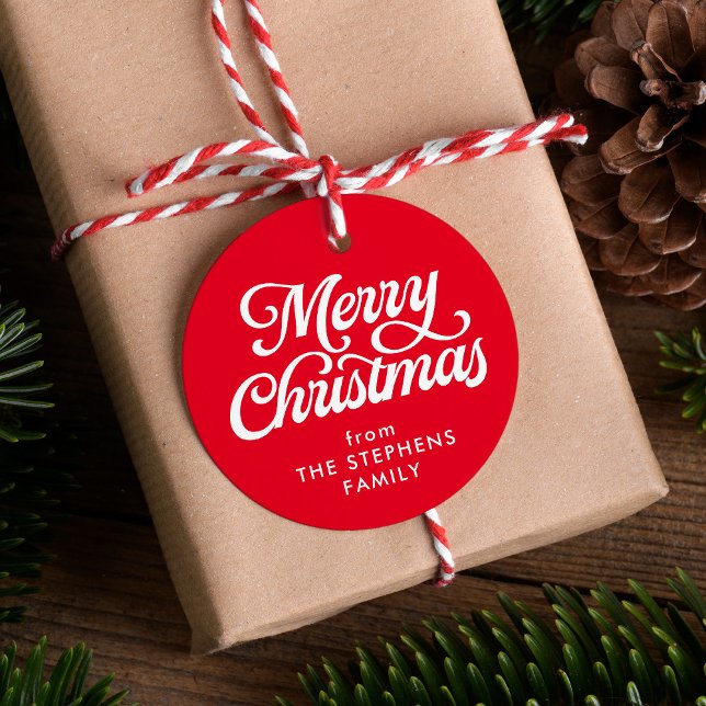 Clássica de Natal feliz com a etiqueta vermelha de (Criador carregado)