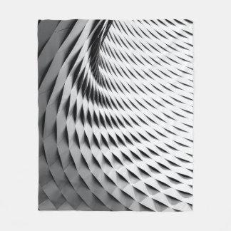 Cobertor De Velo A curved facade covered in white latticework