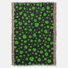 Cobertor Pattern of green shamrocks on black background