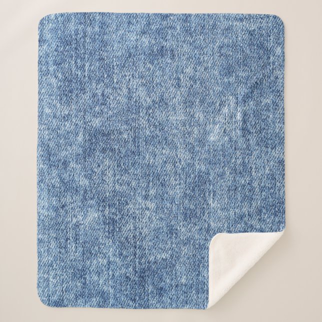 Cobertor Sherpa Lave com ácido o denim azul, textura próxima. (Frente)