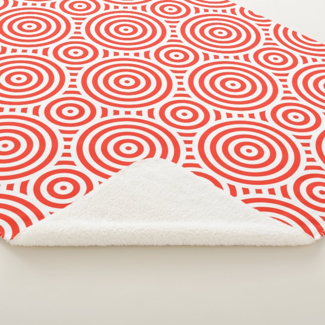 Cobertor Sherpa Padrão circular aninhado laranja e branco (3/4)