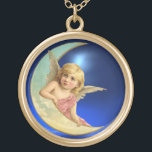 COLAR BANHADO A OURO MOON ANGEL<br><div class="desc">Bronzeado,  anjo romântico de olhos azuis pendurado na Lua com uma brilhante pedra azul de apphire em 3D.</div>