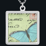 Colar Banhado A Prata Borboleta de asa azul no cartão postal<br><div class="desc">Este cartão postal teal carregar uma mensagem de beleza. Uma delicada borboleta de asas azuis repousa no cartão,  ocultando alguns dos escritos que contém. Este impressão do Vision Studio faria um excelente adicional para sua casa!</div>