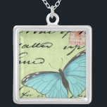 Colar Banhado A Prata Borboleta de asa azul no cartão postal<br><div class="desc">Este cartão postal teal carregar uma mensagem de beleza. Uma delicada borboleta de asas azuis repousa no cartão,  ocultando alguns dos escritos que contém. Este impressão do Vision Studio faria um excelente adicional para sua casa!</div>