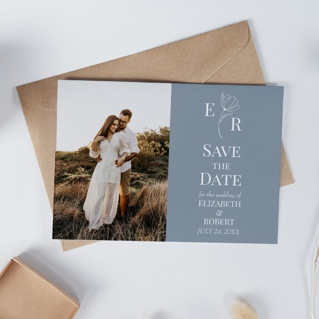Convite de Data de Salvamento de Foto Monograma Fl (Dusty Blue Floral Monogram Custom Photo Wedding Invitation on white table with neutral decoration.)