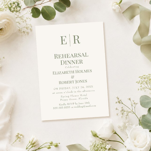 Convite de Jantar de Ensaios com Monograma de Oliv (Olive Monogram Rehearsal Dinner Invitation on a table with white roses)