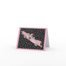 Poodle no Natal em um conversível rosa