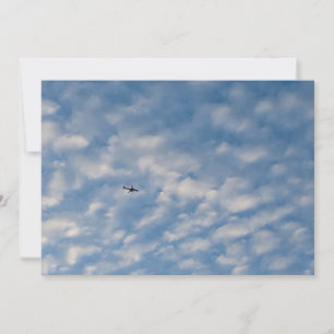 Convites Airplane Crossing a Cloud-Filled Blue Sky