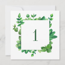 Número de mesa com folhagem verde. Casamento com f