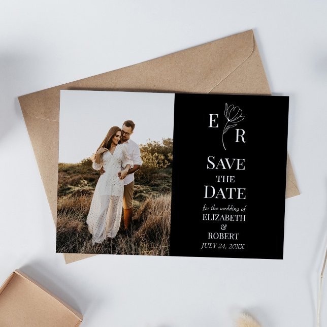 Convites Salvar a Data com Monograma Floral Preto e Foto Pe (Black Floral Monogram Custom Photo Save the Date Invitation on white table with dry wildflowers.)