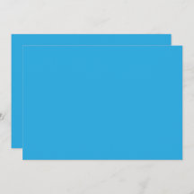 um fundo azul com um gato preto e branco