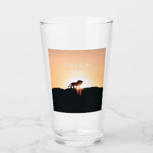 Copo De Pint Leão no pôr do sol Vivendo na EDGE