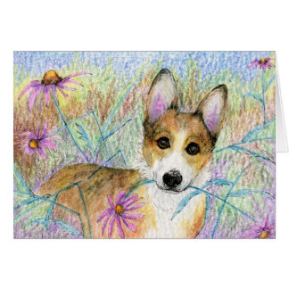 Corgi bonito com o CARTÃO cor-de-rosa da flor