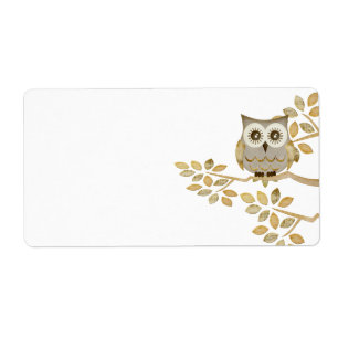 Coruja larga dos olhos na etiqueta da árvore