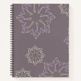 Cuaderno de espiral con diseño de plantas.