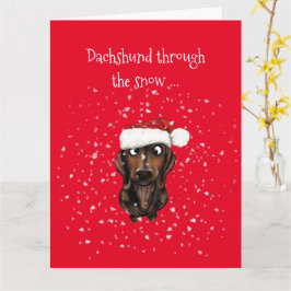 Dachshund através da neve... Cartão de Natal