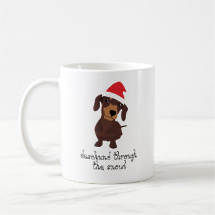 Daschund bonito através da caneca do Xmas da neve