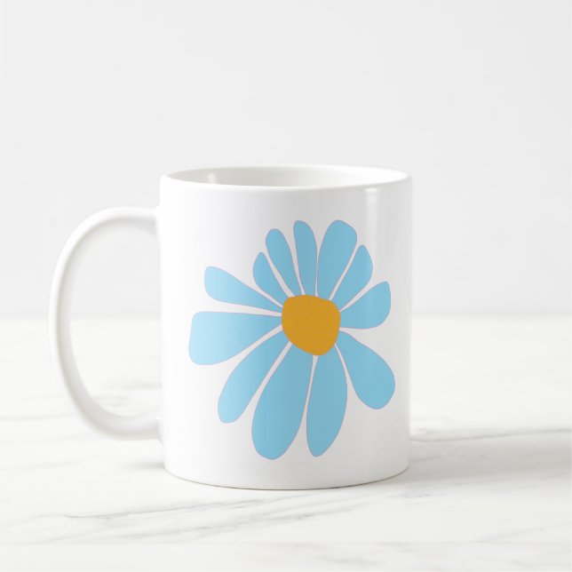 De Café caneca branca com uma margarida azul suave desenha (Esquerda)