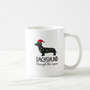 De Café Dachshund através da caneca da neve, Natal