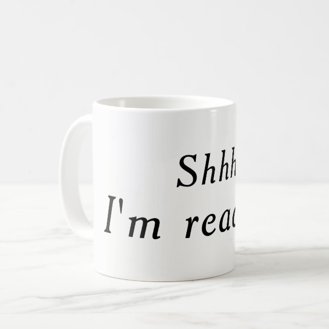 De Café Shhh, eu estou lendo a caneca (branca) (Frente Esquerda)