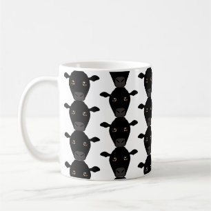 De Café Vacas negras na caneca