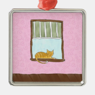 De Metal Gatinho amarelo em um ornamento da janela