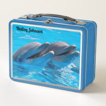 Dois golfinhos em água azul